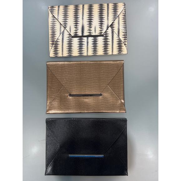 BCBGMaxAzria Clutch Bundle (3) Black Bronze & Black/White Envelope Bags Sale!
As - Picture 8 of 11